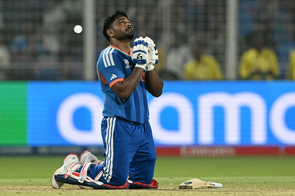 India's Sanju Samson prays as he celebrates his team's win against West Indies  