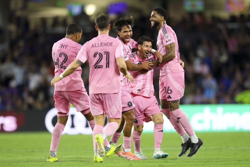  Inter Miami CF forward Lionel Messi (10) reacts with midfielder Telasco Segovia (8) after scoring a goal against Orlando City 