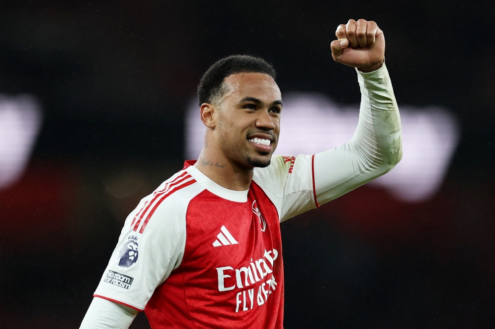 Arsenal's Gabriel Magalhaes celebrates after the match