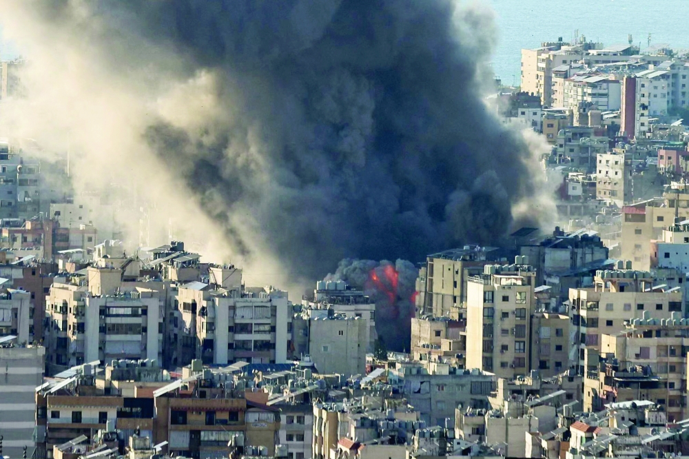 Smoke plumes billow following Israeli bombardment on Beirut's southern suburbs on Monday. - AFP