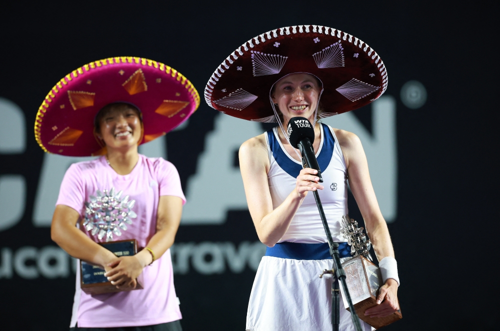   Spain's Cristina Bucsa and China's Jiang Xinyu receive their trophies  