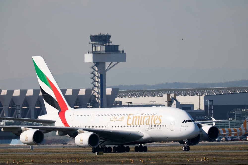 An Emirates plane with German tourists evacuated from the Middle East arrives from Dubai, at the airport in Frankfurt