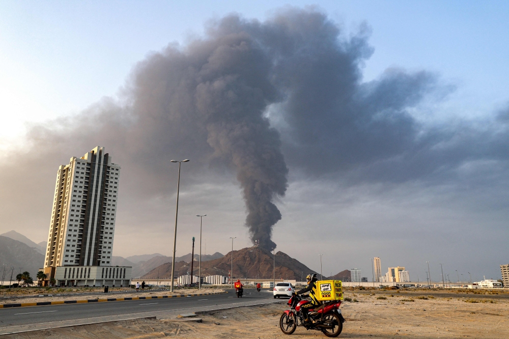 smoke plume billows following an explosion in the Fujairah industrial zone on March 3 