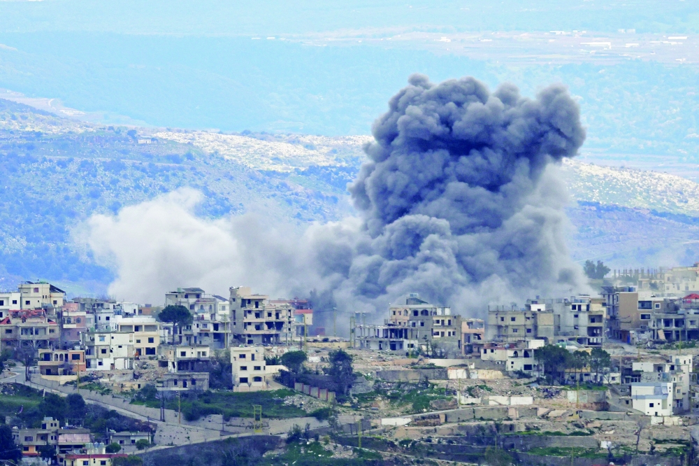 Smoke rises from Israeli bombardment on the southern Lebanese village of Khiam. — AFP
