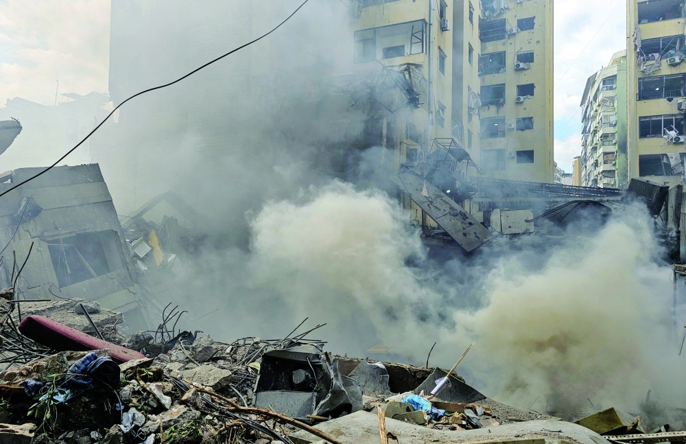 Smoke billows from the site of an Israeli air strike, in Beirut. — AFP