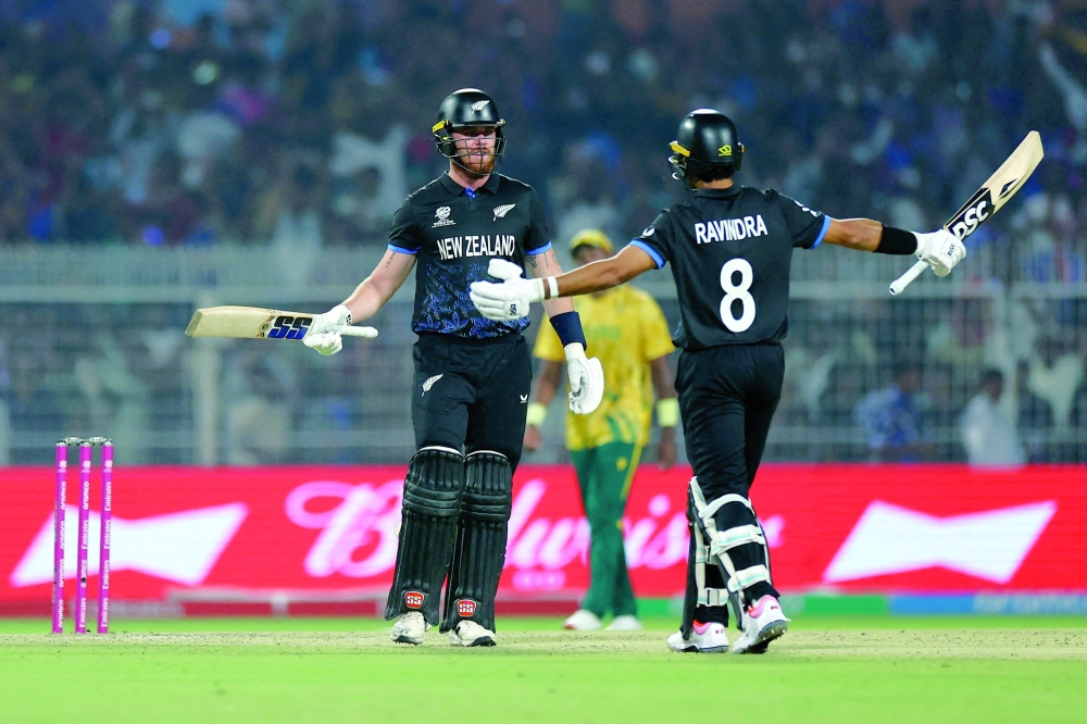 Cricket - ICC Men's T20 World Cup 2026 - Semi Final - South Africa v New Zealand - Eden Gardens, Kolkata, India - March 4, 2026 New Zealand's Finn Allen and Rachin Ravindra celebrate after the match REUTERS/Anushree Fadnavis