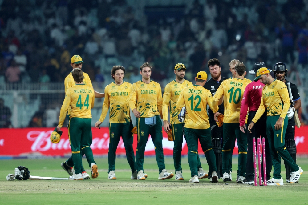   New Zealand's Finn Allen and Rachin Ravindra with South Africa players after the match  Sahiba Chawdhary