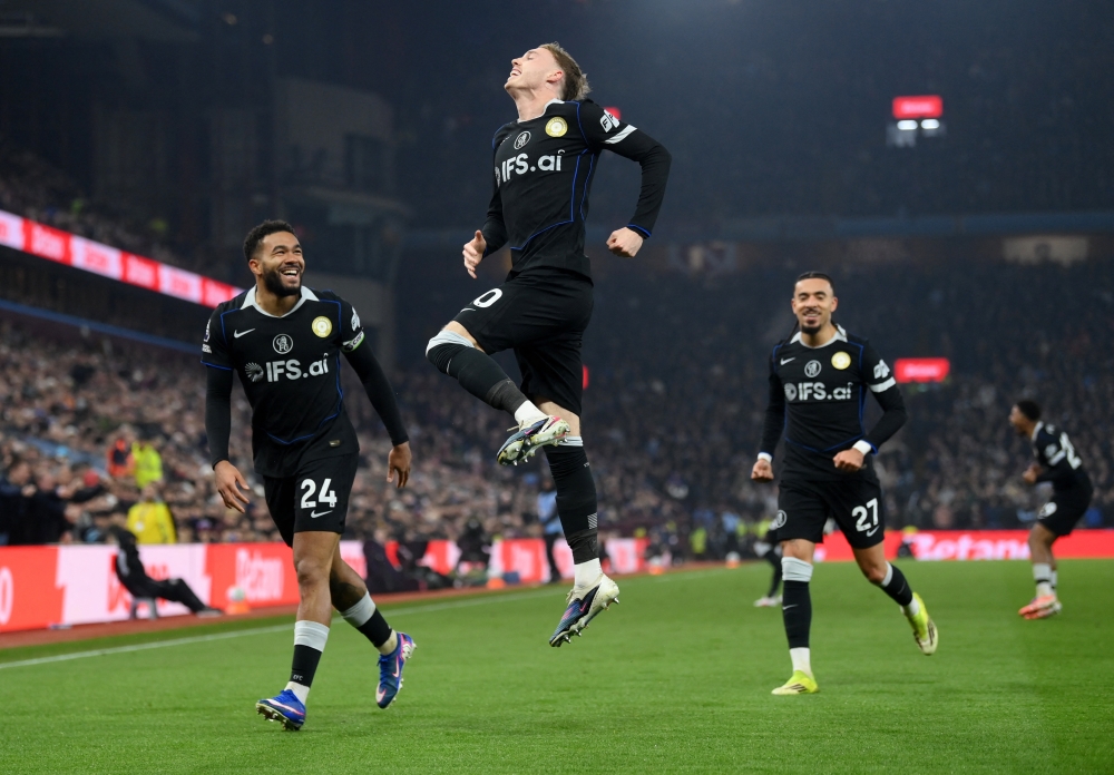  Chelsea's Cole Palmer celebrates scoring their third goal with Reece James 