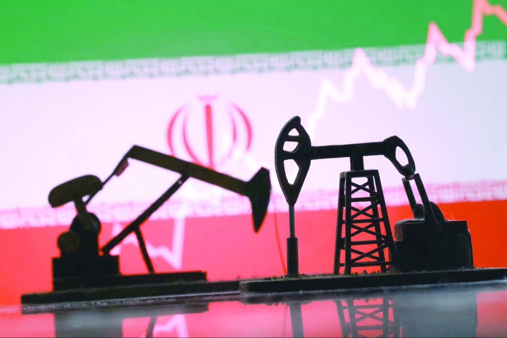 3D-printed oil pump jacks, Iranian flag, and a rising stock graph appear in this illustration. REUTERS