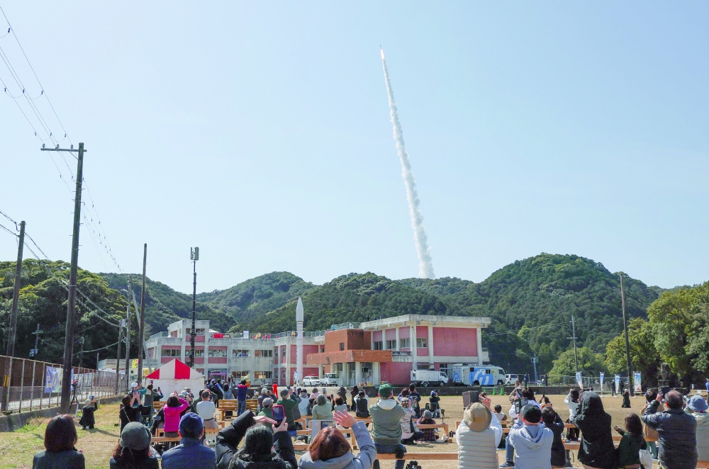 The launch scene of Kairos No 3 is watched by people in Nachikatsuura Town, Wakayama Prefecture. - AFP