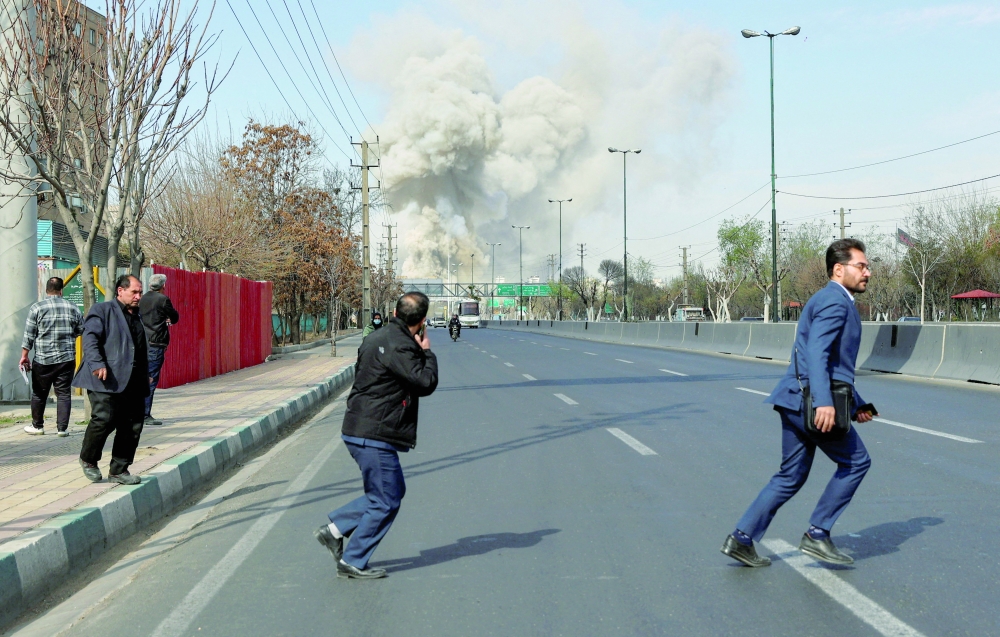 Smoke rises following an explosion, amid the US-Israeli conflict with Iran. - Reuters 