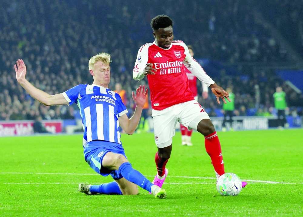 Soccer Football - Premier League - Brighton & Hove Albion v Arsenal - The American Express Community Stadium, Brighton, Britain - March 4, 2026 Brighton & Hove Albion's Jan Paul van Hecke in action with Arsenal's Bukayo Saka Action Images via Reuters