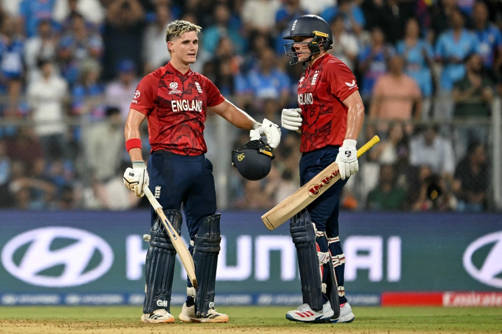 England's Jacob Bethell (L) celebrates with Sam Curran after scoring a century (100 runs)  