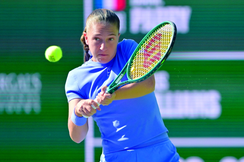 Diane Parry (FRA) hits a shot during her first round match against Venus Williams (USA) during the BNP Paribas Open at the Indian Wells Tennis Garden. — Imagn Images