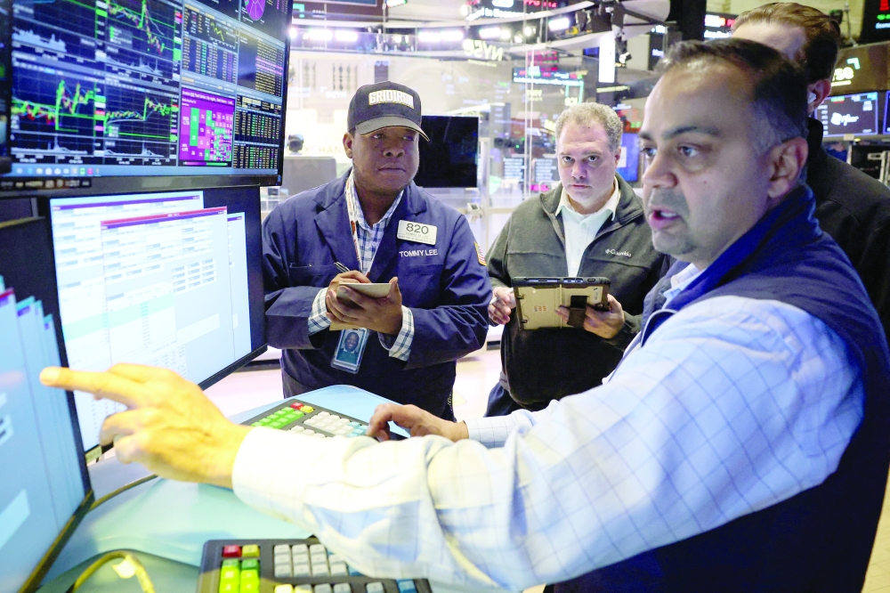 Traders work on the floor at the NYSE in New York City. — Reuters
