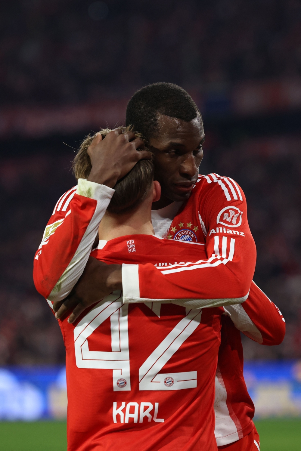 Bayern Munich's Senegalese forward #11 Nicolas Jackson celebrates with Bayern Munich's German midfielder #42 Lennart Karl 