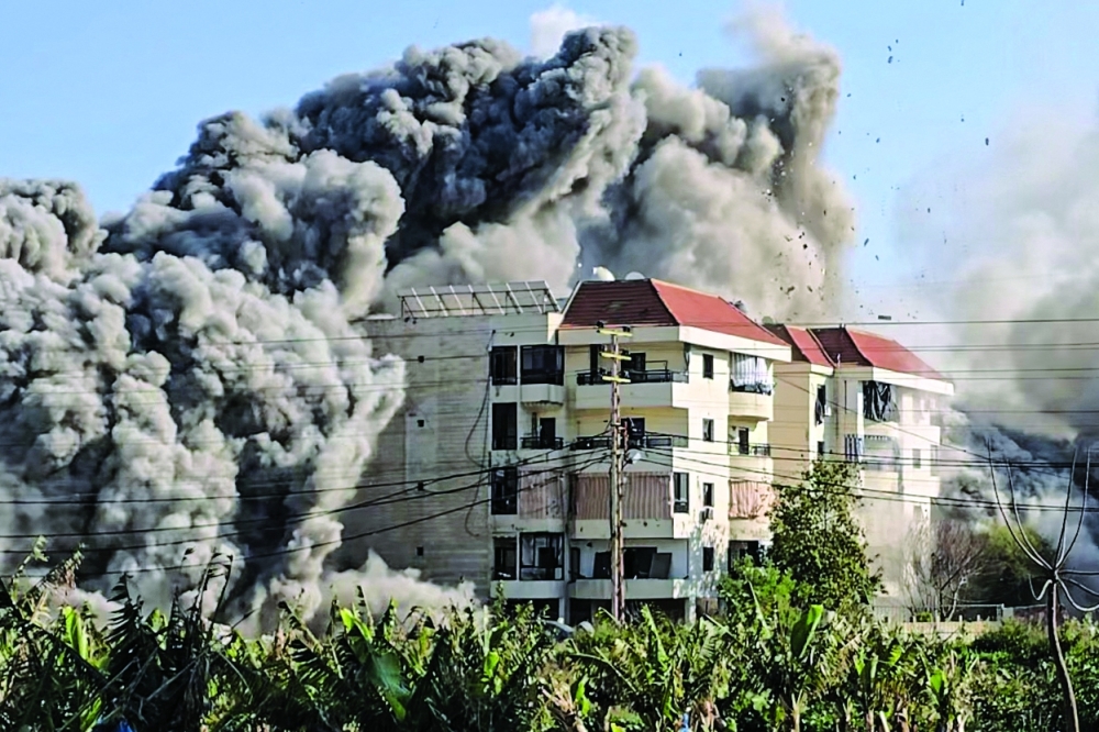 Smoke rises from the site of an Israeli airstrike that targeted an area in the southern coastal city of Tyre on Saturday. — AFP