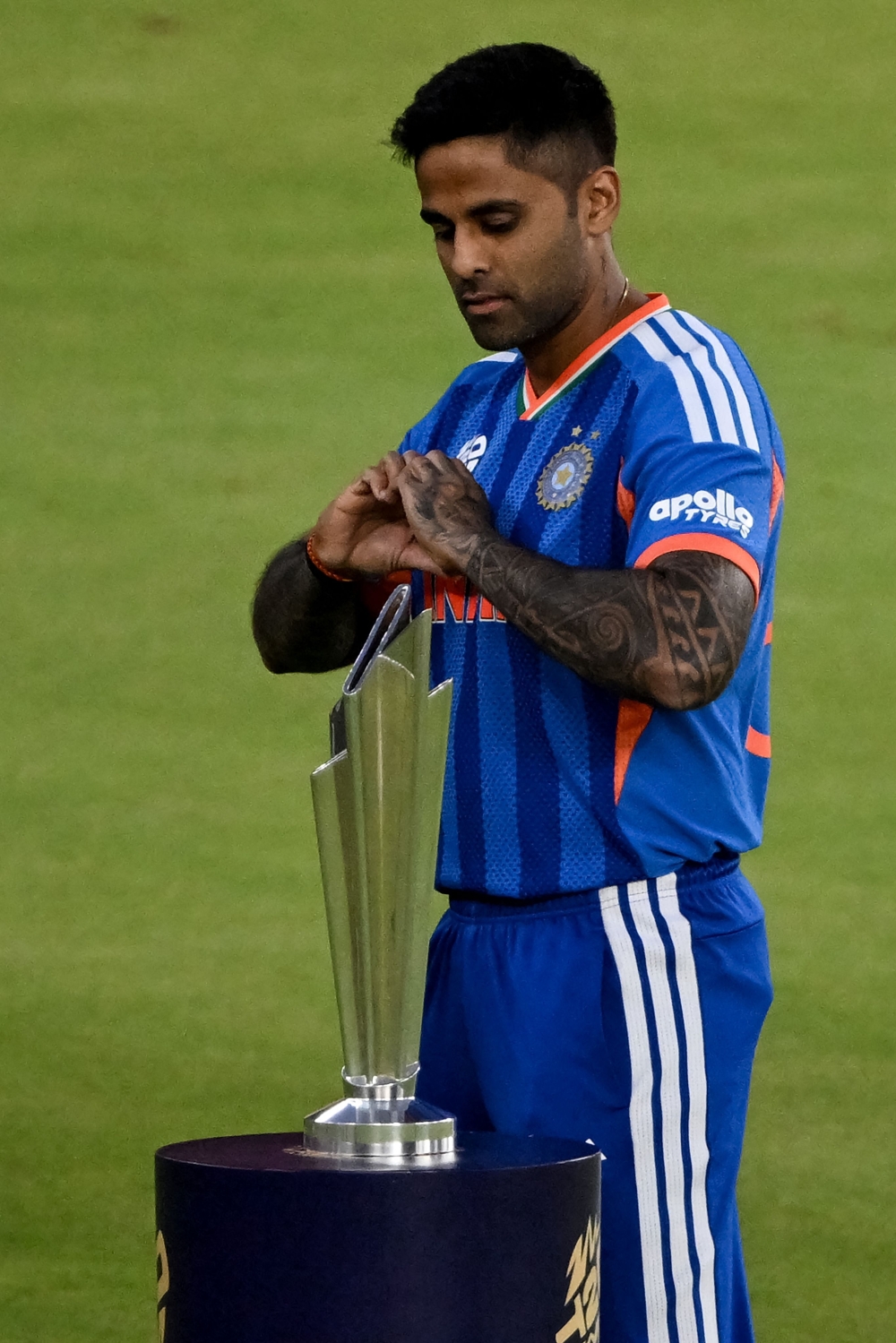 India's captain Suryakumar Yadav poses with the 2026 ICC Men's T20 Cricket World Cup trophy 