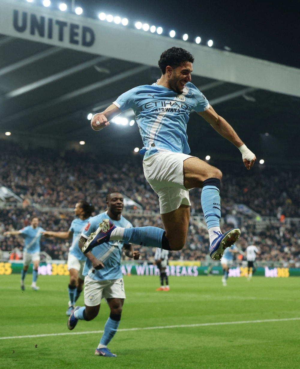  Manchester City's Omar Marmoush celebrates scoring their second goal with Manchester City's Jeremy Doku 