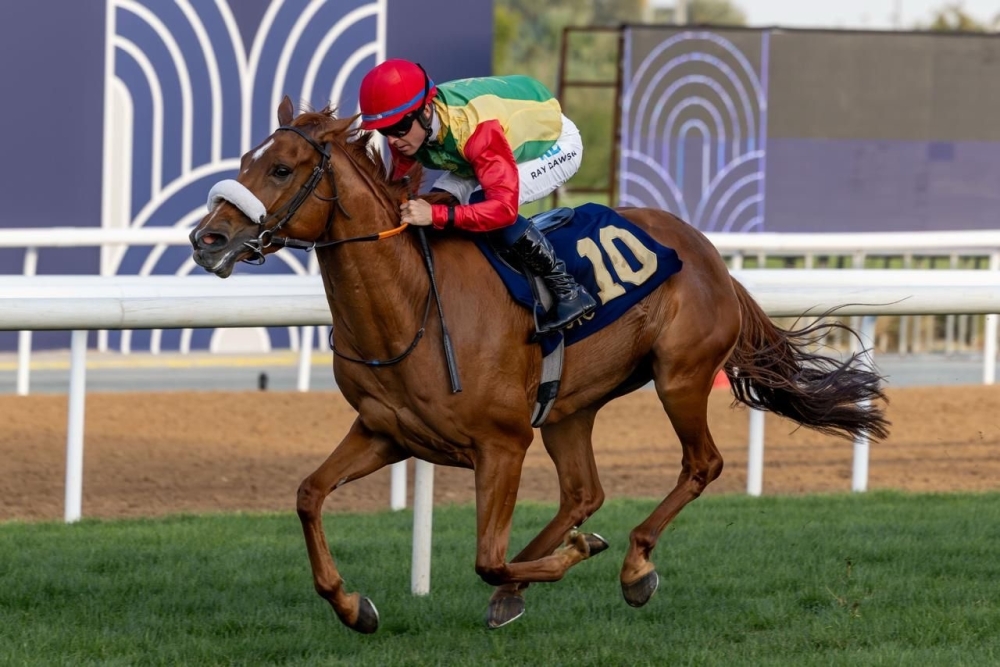  The horse 'Azza', owned by the Royal Cavalry, crossing finish line 