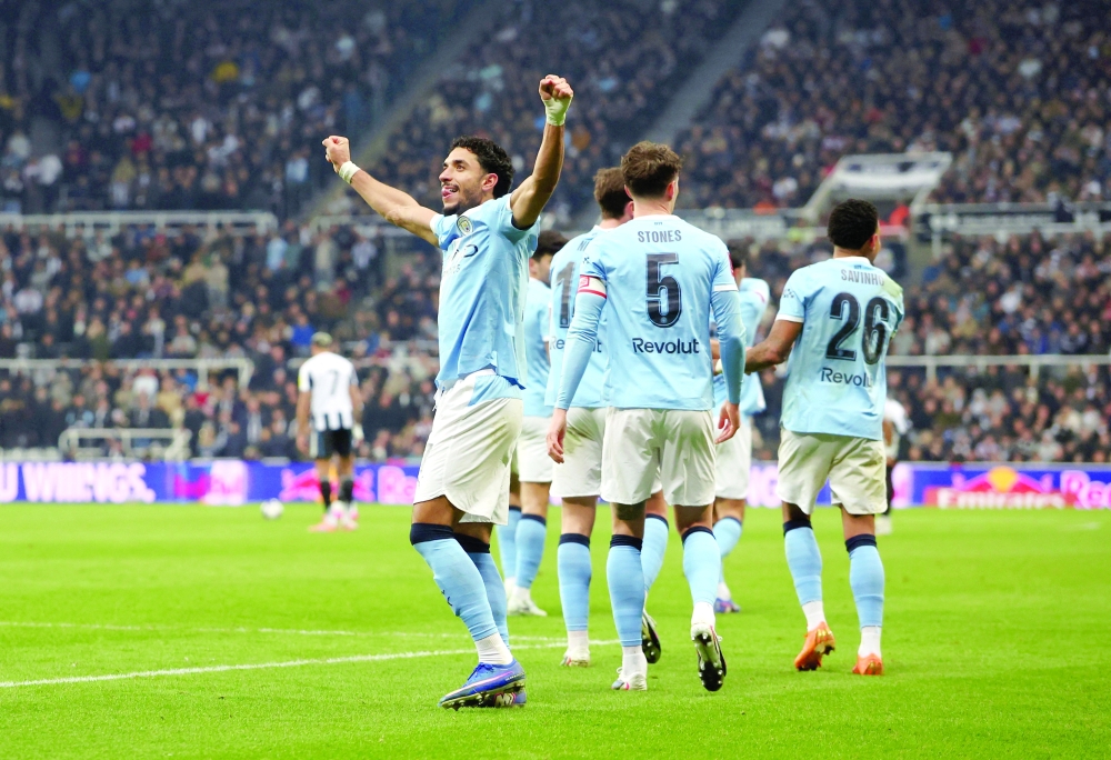 Manchester City's Omar Marmoush celebrates scoring their third goal.— REUTERS
