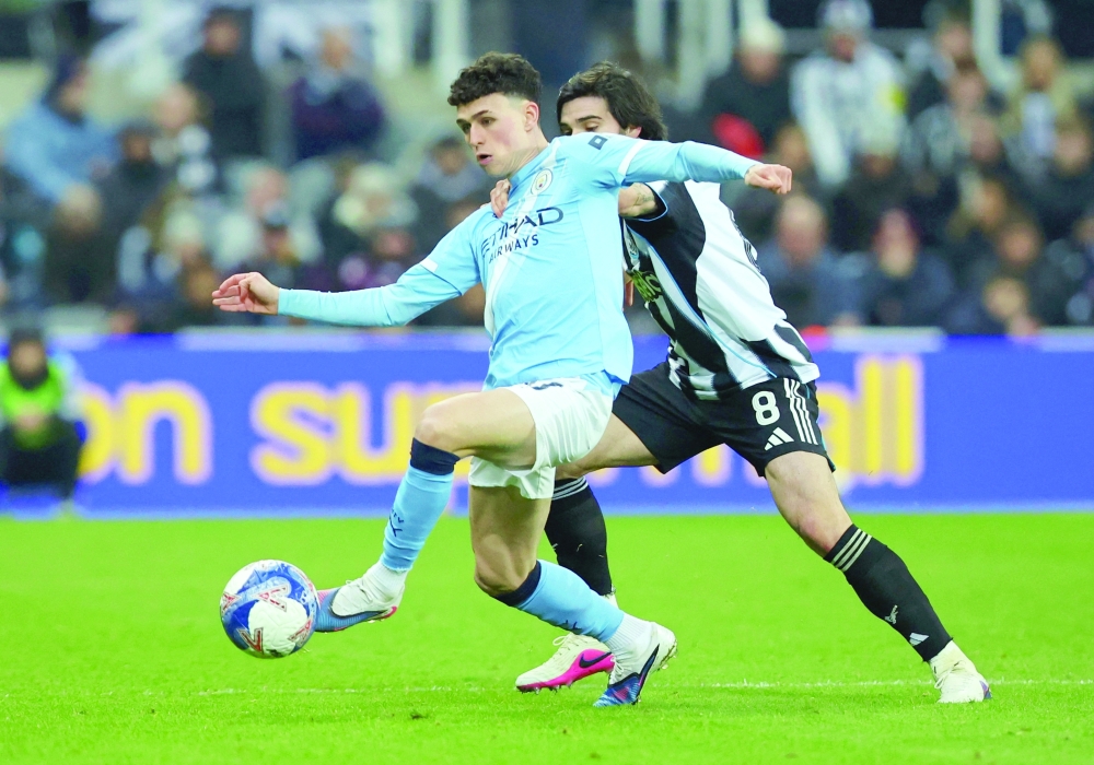 Manchester City's Phil Foden in action with Newcastle United's Sandro Tonali Action.—Reuters