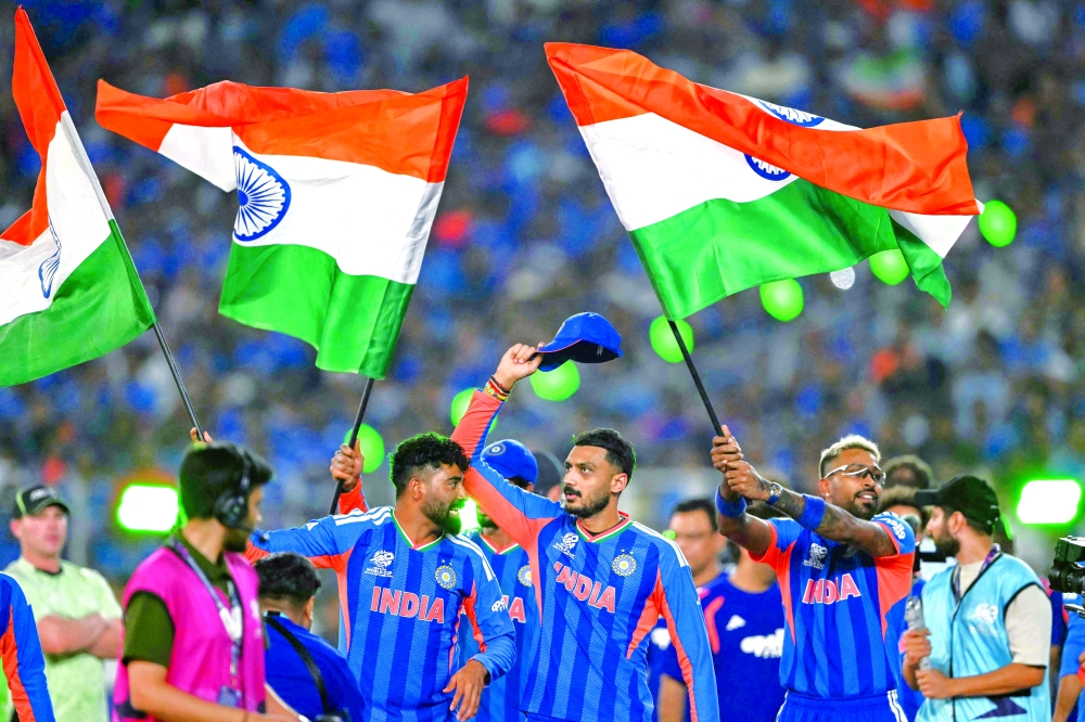 India's players celebrate after winning the 2026 ICC Men's T20 Cricket World Cup final match against New Zealand at the Narendra Modi Stadium in Ahmedabad. - AFP
