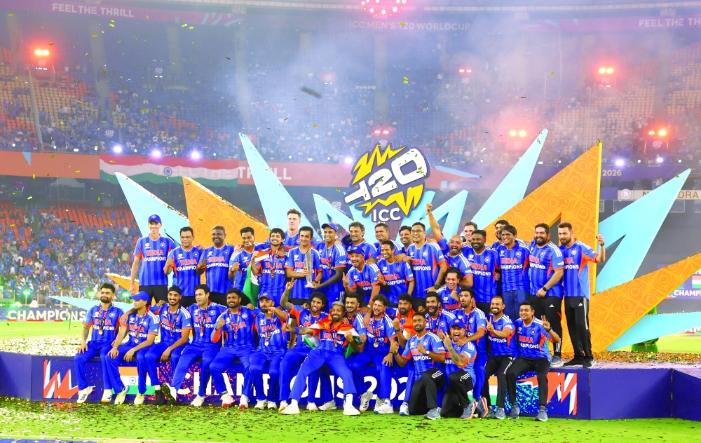 India players celebrate on the podium with the trophy after winning the ICC Men's T20 World Cup  - Reuters 