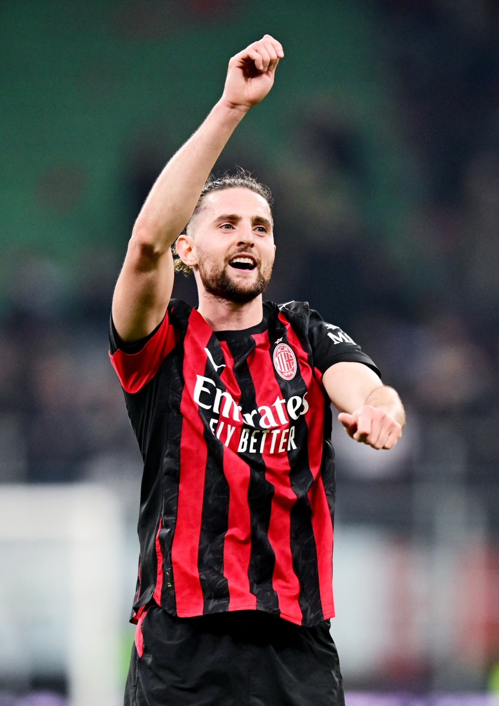 AC Milan's Adrien Rabiot celebrates after the match 