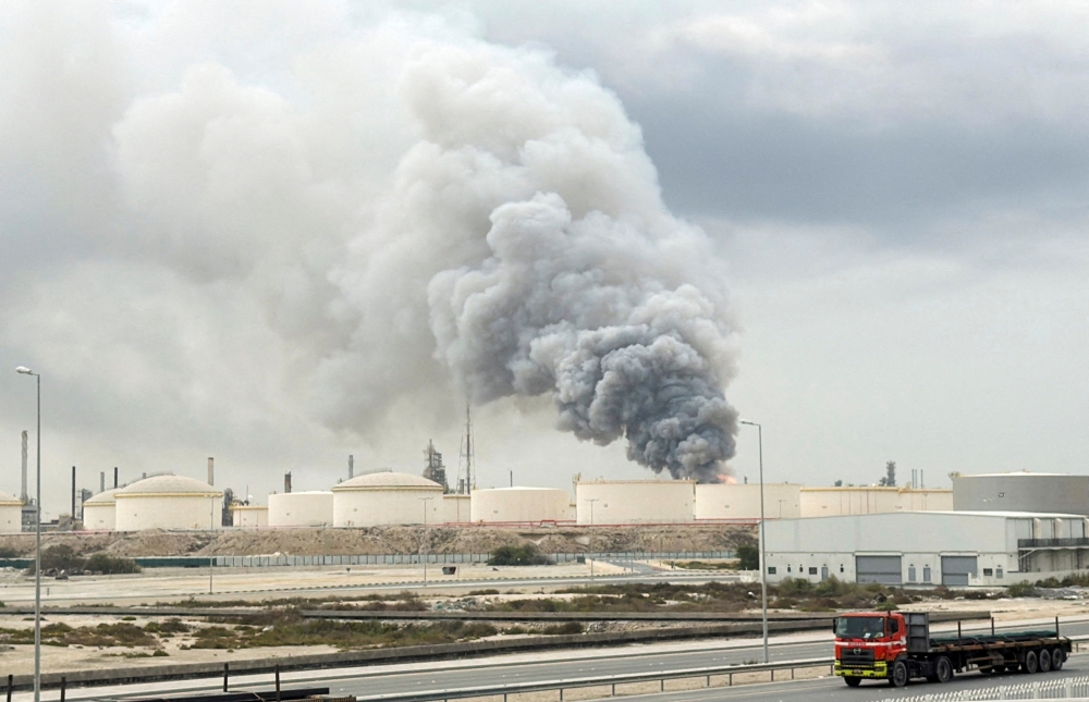 Smoke rises following a strike on the Bapco Oil Refinery on Sitra Island