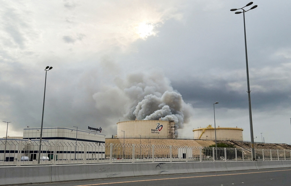 Smoke rises following a strike on the Bapco Oil Refinery on Sitra Island
