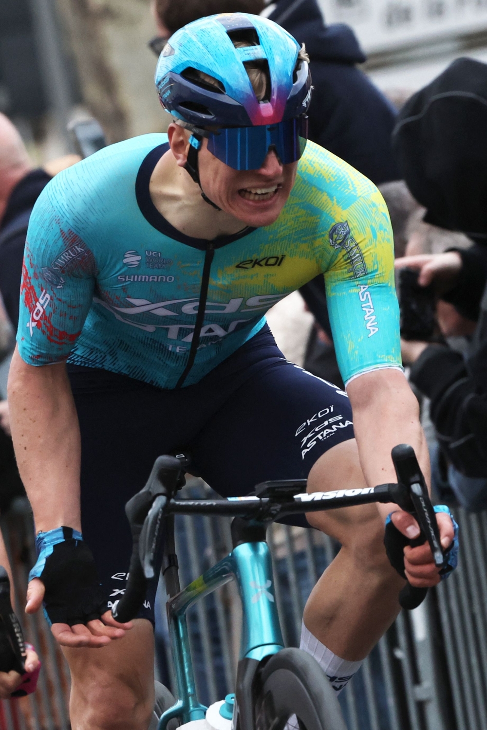 XDS Astana Team's German rider Max Kanter (2nd R) celebrates as he crosses the finish line 