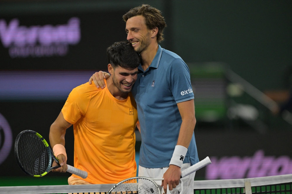  Carlos Alacraz (ESP) shakes hands with Arthur Rinderknech (FRA) after their third round  