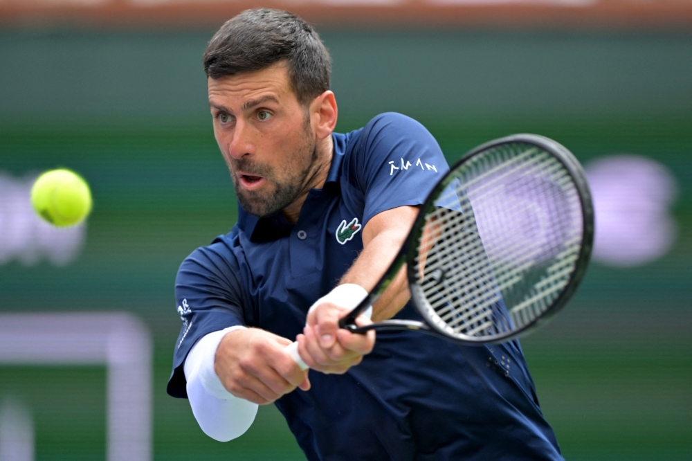 Novak Djokovic (SRB) hits a shot during his third round match as he defeated Aleksandar Kovacevic (USA) 