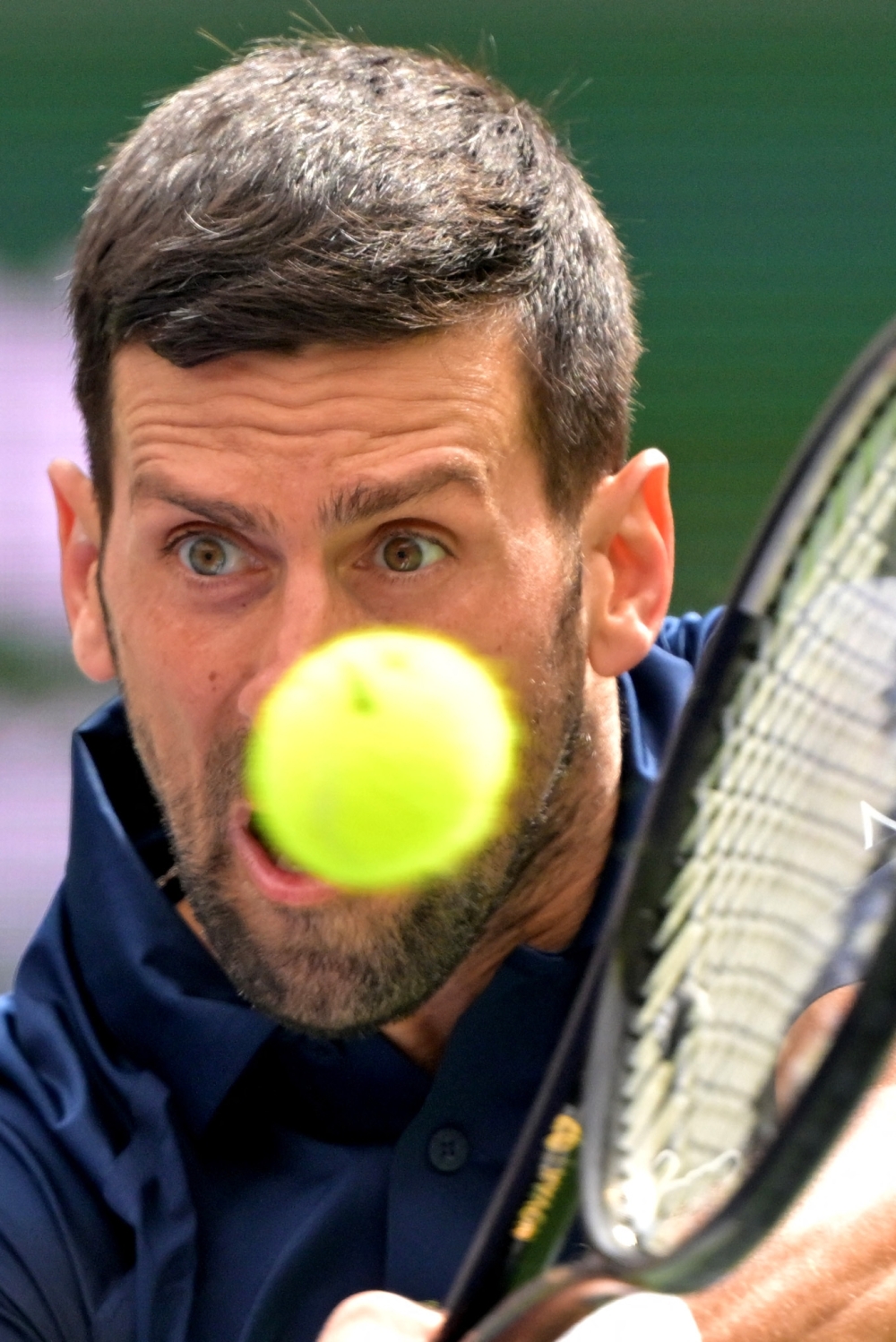  Novak Djokovic (SRB) hits a shot during his third round match as he defeated Aleksandar Kovacevic (USA)  