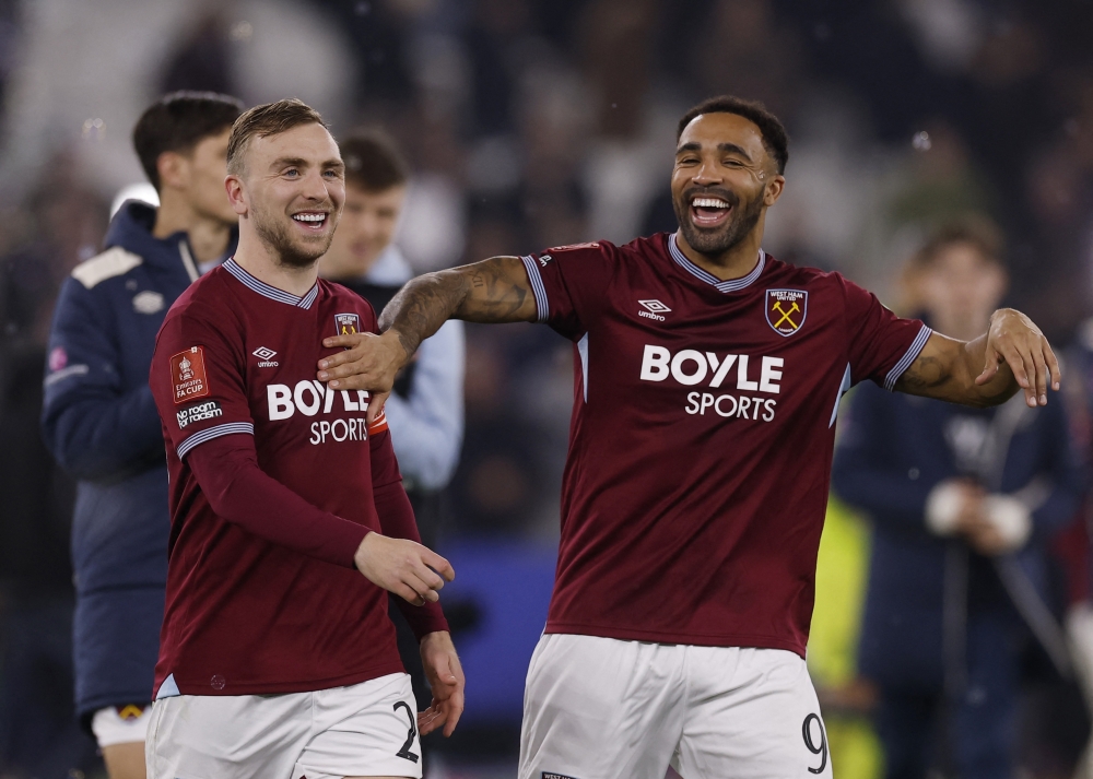  West Ham United's Jarrod Bowen and Callum Wilson celebrate winning the penalty shootout with teammates  