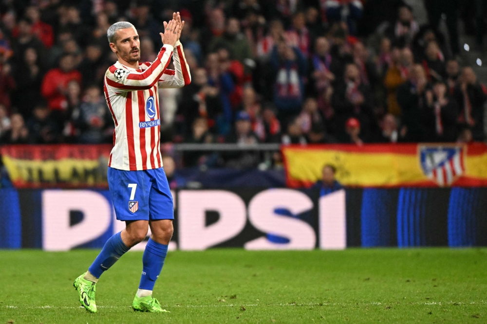 Atletico Madrid's French forward #07 Antoine Griezmann calps after being substituted  