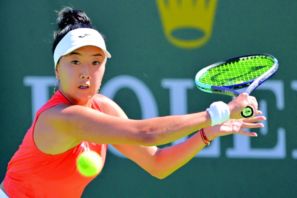 Ann Li (USA) hits a shot against Talia Gibson (AUS) in her first round match during the BNP Paribas Open at the Indian Wells Tennis Garden. — Imagn Images