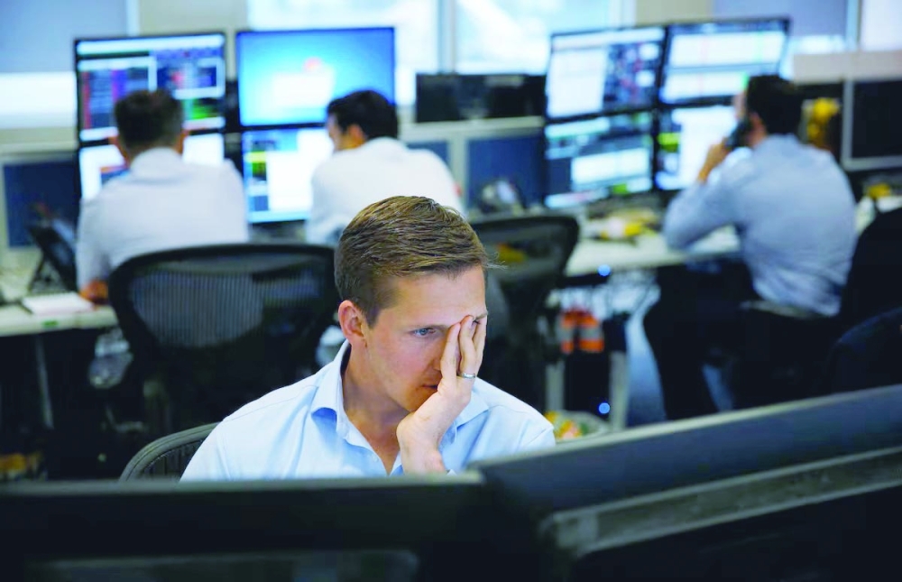 A risk manager works on the trading floor at IG Index in London, Britain August 25, 2015. REUTERS/Suzanne Plunkett/File Photo Purchase Licensing Rights, opens new tab