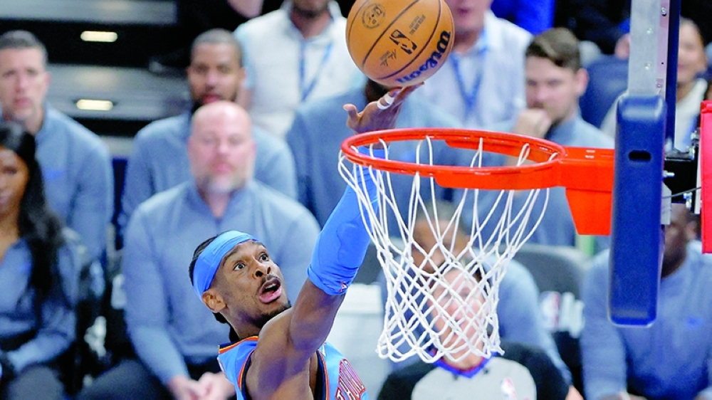 Oklahoma City Thunder's Shai Gilgeous-Alexander (2) goes up for a basket against the Boston Celtics at Paycom Center. — Imagn Images