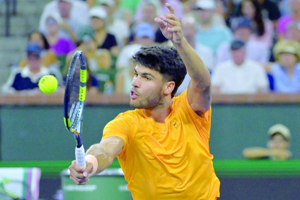 Carlos Alcaraz (ESP) plays a shot against Cameron Norrie (GBR) during his quarterfinal match in the BNP Paribas Open at the Indian Wells Tennis Garden. — Imagn Images