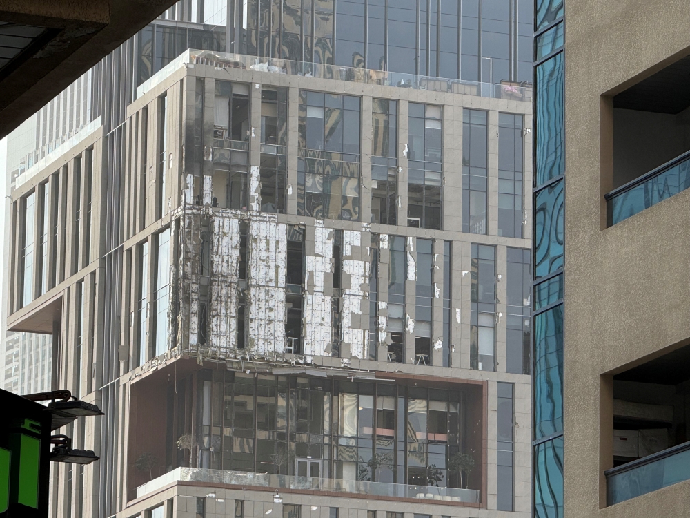 A damaged building in DIFC Dubai, after debris from a successful interception caused minor damage to the facade, amid the U.S.-Israeli conflict with Iran, in Dubai