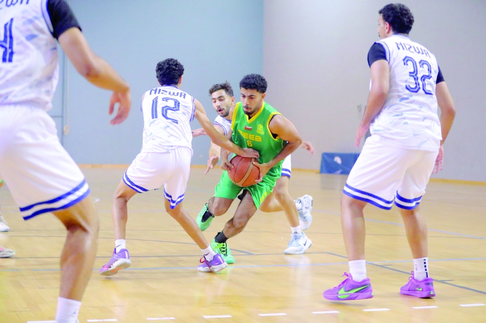 Seeb's player battles hard against Nizwa during U18 basketball showdown.