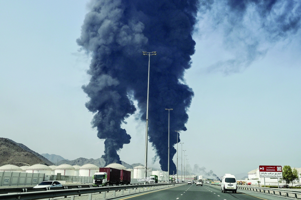 Smoke rises from the direction of an energy installation in the Gulf emirate of Fujairah. — AFP