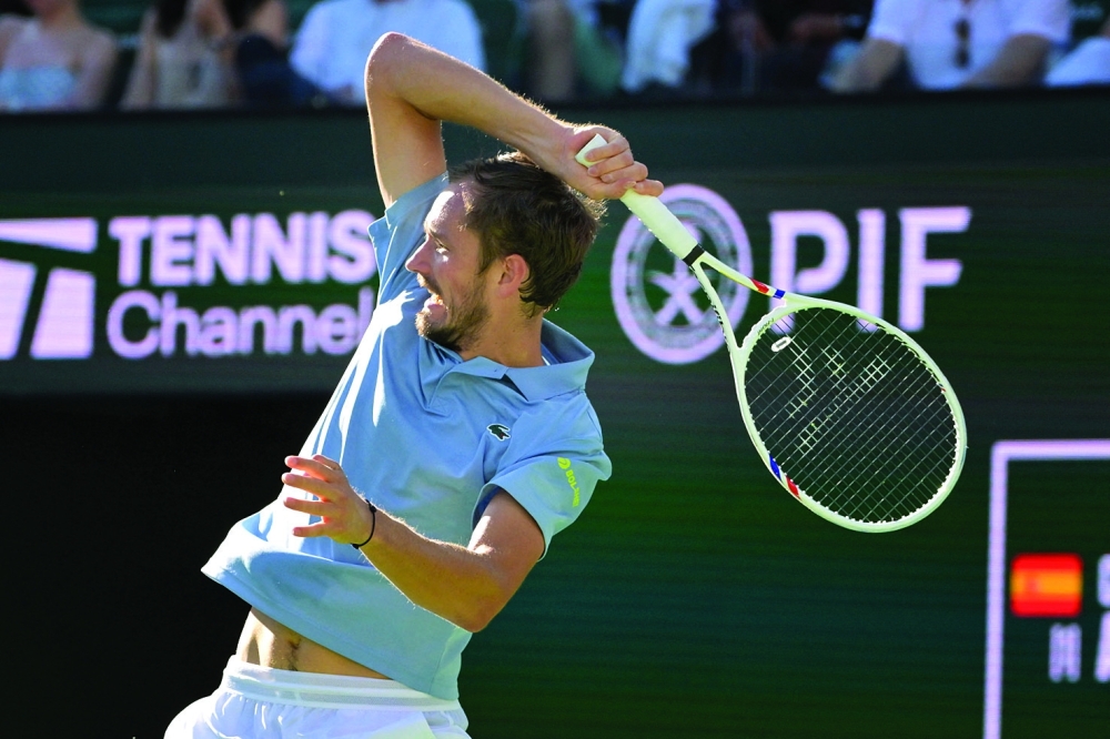 Daniil Medvedev (RUS) hits a shot in his semifinal match defeating Carlos Alcaraz (ESP) in the BNP Paribas Open at the Indian Wells Tennis Garden. — Imagn Images