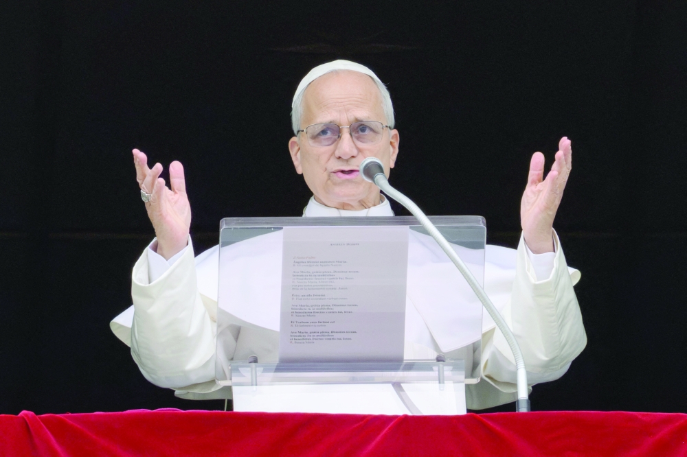 Pope Leo XIV leads the Angelus prayer from a window of the Apostolic Palace, at the Vatican. — Reuters