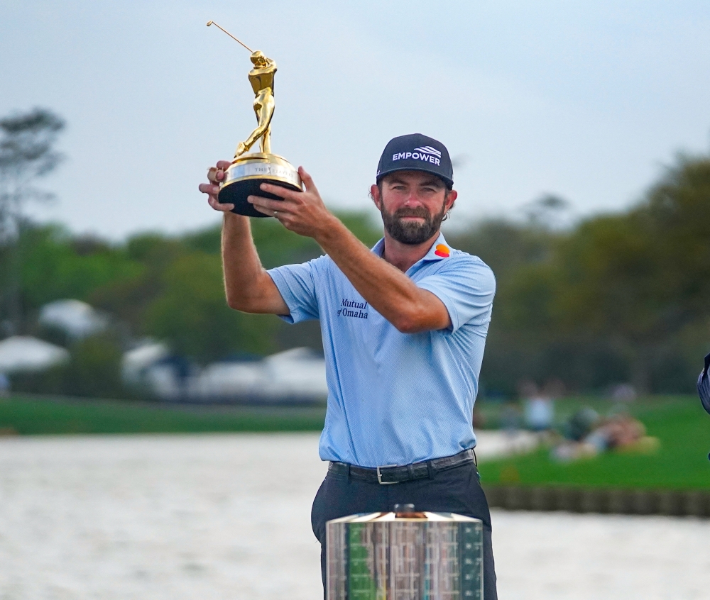  Cameron Young poses with trophy after winning THE PLAYERS Championship golf tournament 