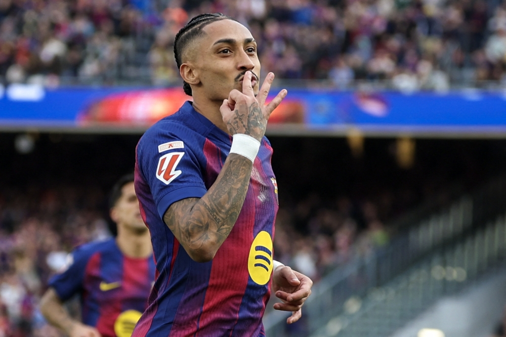 Barcelona's Brazilian forward #11 Raphinha celebrates scoring his team's fourth goal and his hat-tick 