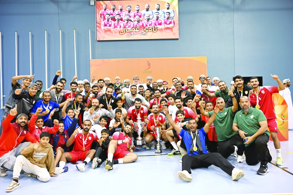 Oman Club celebrating with the trophy after the wining. — Khalfan al Ruzaiqi