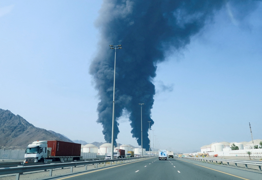 moke rises in the Fujairah oil industry zone, caused by debris after interception of a drone by air defenses, according to the Fujairah media office, amid the U.S.-Israel conflict with Iran, in Fujairah, United Arab Emirates, March 14, 2026. REUTERS/Staff/File Photo